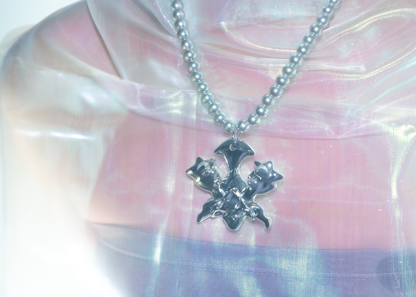 Model wearing 3D printed silver-plated beetle inspired resin necklace/jewelry