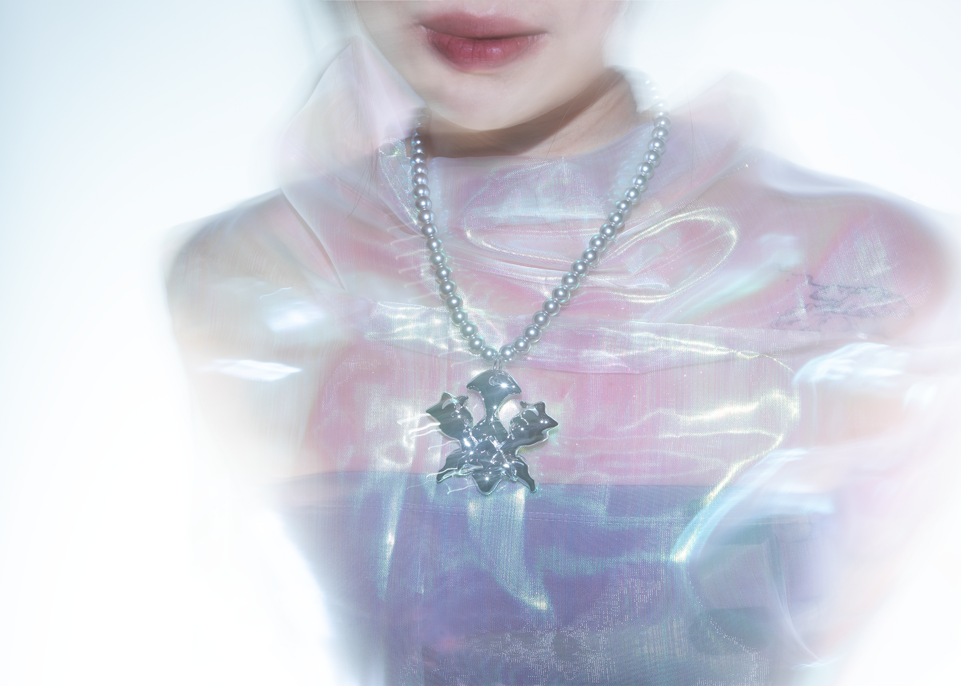 Model wearing 3D printed silver-plated beetle inspired resin necklace/jewelry
