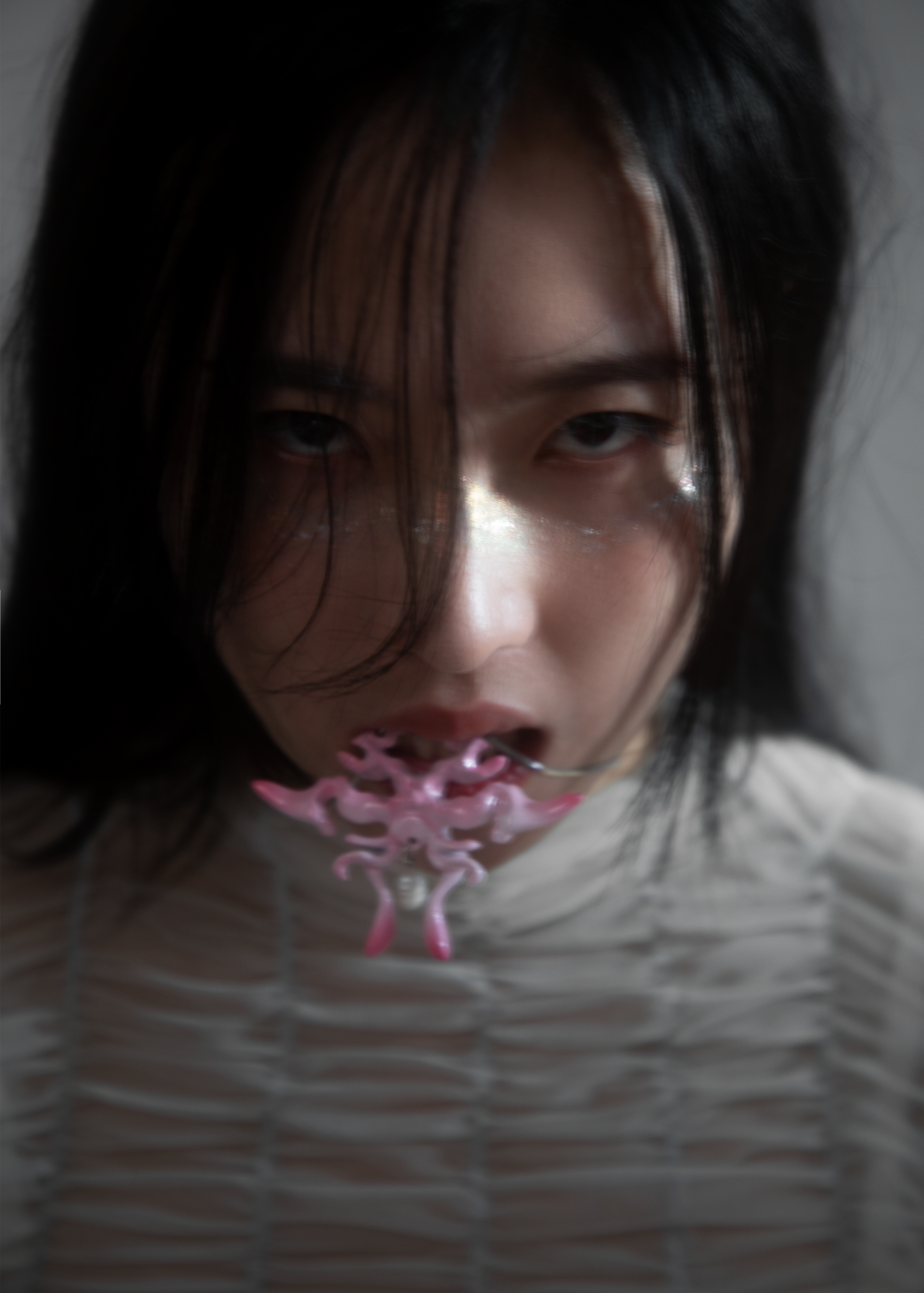 Model wearing 3D printed necklace earrings set with gradient cherry blossm pink finish
